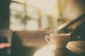 Steamy coffee cup in the sunlight Royalty Free Stock Photo