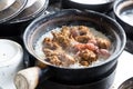 Steamy hot clay pot chicken rice being cooked in restaurant. Popular food in Malaysia