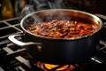 steamy pot of homemade chili on stovetop