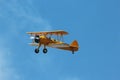 Stearman Biplane Flying Through Blue Skies Royalty Free Stock Photo