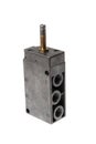 Steel alloy pneumatic solenoid 5/2 switch valve with its input in front, without the magnetic coil. Isolated on white background