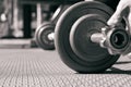 The steel barbell dumbbell in a gym muscle-building black and white image, life and fitness concept with copy space Royalty Free Stock Photo