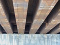 Steel beams on concrete rusting view under car road bridge in Indianapolis Indiana.