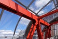 Steel beams in red against a blue sky. Overhead passage. Industrial background Royalty Free Stock Photo