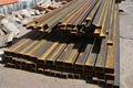 Steel beams for roofing. Rust steel channel bunch on house construction site outdoor. Royalty Free Stock Photo