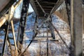 Steel beams under a railway bridge on a sunny winter afternoon in Northern Ontario Royalty Free Stock Photo