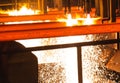 Steel Billets at Torch Cutting. Hot billet bloom continuous casting, also called strand casting Royalty Free Stock Photo