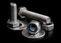 Steel bolts and nuts with washers on black background close-up Royalty Free Stock Photo