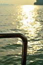 Steel of bottom boat golden sunlight on water