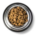 A Steel Bowl full of dog-food. Royalty Free Stock Photo