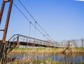 Steel bridge and gas pipeline through irrigation canal Royalty Free Stock Photo