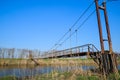 Steel bridge and gas pipeline through irrigation canal Royalty Free Stock Photo