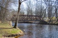 The steel bridge over the river in the park of Iecava Royalty Free Stock Photo