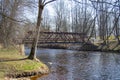 The steel bridge over the river in the park of Iecava