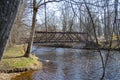 The steel bridge over the river in the park of Iecava Royalty Free Stock Photo