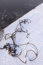 Steel wire rope and chain in snow Royalty Free Stock Photo