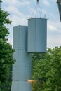 Steel cables and large crane lift a section of the old water tower Royalty Free Stock Photo