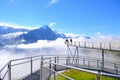 Steel catwalk over Alps round the First top station above Grindelwald, Switzerland in summer.