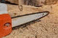 Steel chain chainsaw. sawing firewood outdoors Royalty Free Stock Photo