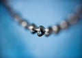 Steel chain over blue background