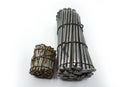Steel construction nails of different lengths tied together in groups Royalty Free Stock Photo