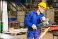Steel construction worker cutting metal with angle grinder Royalty Free Stock Photo