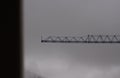 Steel crane with sky with clouds