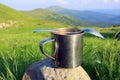 Steel cup and spoon Royalty Free Stock Photo