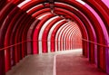 The Smartie Tube, the SECC elevated red steel and perspex covered walkway and cycle lane bridging the Clydeside Expressway, giving Royalty Free Stock Photo