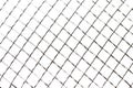 Steel decorative mesh or grid on a white background as a backdrop. Close-up Royalty Free Stock Photo