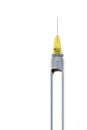 Steel dental syringe for local anesthesia, isolated on white. Carpool syringe for anesthesia in dentistry. Thin needle