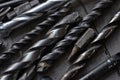 steel drill bits resting on a work bench Royalty Free Stock Photo