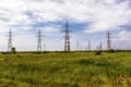 Steel electricity pylon on bright blue sky