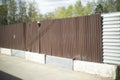 Steel fence. Abandoned construction site. Brown fence Royalty Free Stock Photo