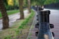 Steel fence in public park, defocused background Royalty Free Stock Photo