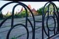 Steel fence in public park, defocused background Royalty Free Stock Photo