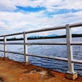 Steel fence by riverside against river view