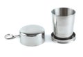 Steel folding cup near cover with key ring Royalty Free Stock Photo