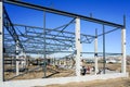 The steel frame of the new building with reinforced concrete supports is under construction Royalty Free Stock Photo