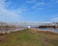 Steel frame railway bridge over the Elbe River on a sunny winter day