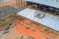 Steel frame truss framework construction of an industrial warehouse building in the construction site Royalty Free Stock Photo