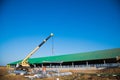 Steel frame workshop is under construction against a blue sky Royalty Free Stock Photo