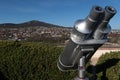 Steel free to use tower viewer binocular scope placed on Nitra castle, with cityscape of Zobor hill and settlements under it.