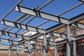 Steel girders and posts to support a roof.