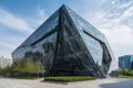 a steel and glass building, with unique architectural details and modern design