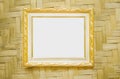 Steel gold picture frame decorative hanging on wood woven wall background