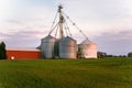 Steel grain bins at sunset Royalty Free Stock Photo