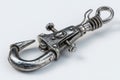 Steel grappling hook with clip on white Ai photo Royalty Free Stock Photo
