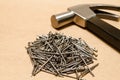 Steel hammer And pile of nails. Royalty Free Stock Photo