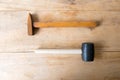 Steel hammer and Rubber Hammer on wood Royalty Free Stock Photo